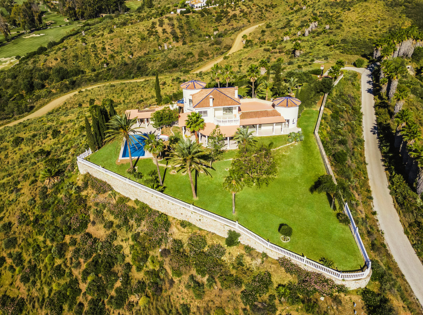 White villa with pool and huge garden, drone picture