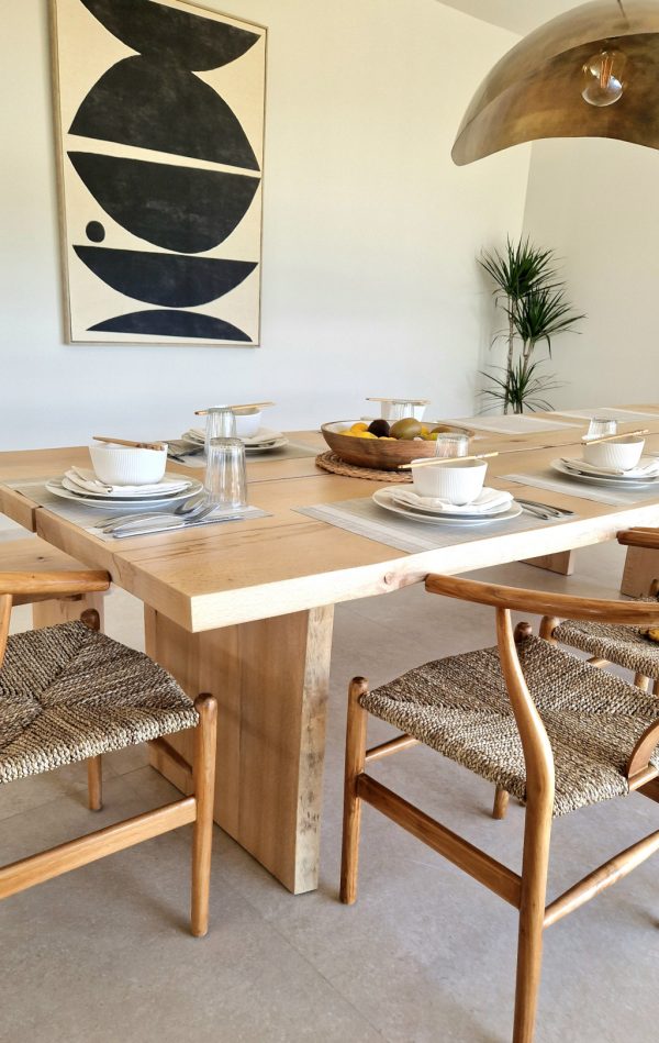 Wooden dining table with dishes