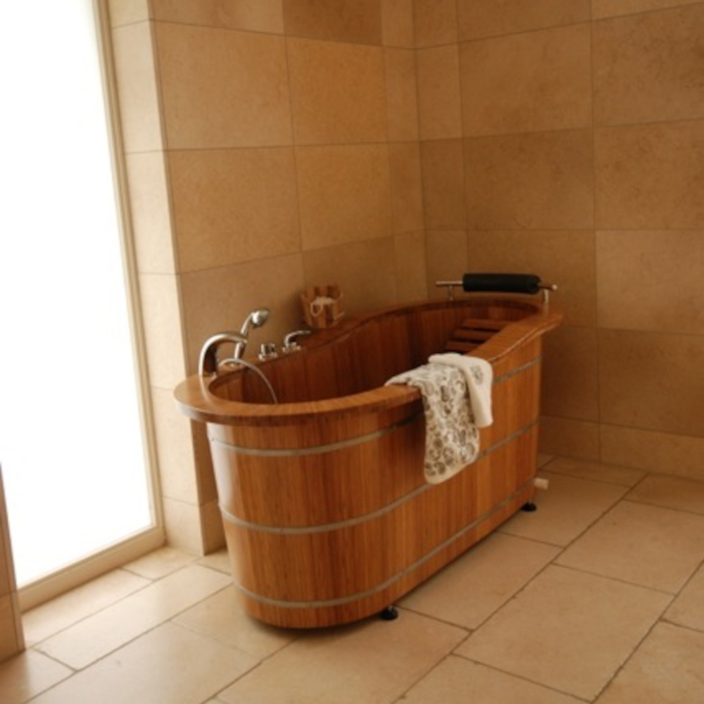 Bathroom with wooden bathtub for one person