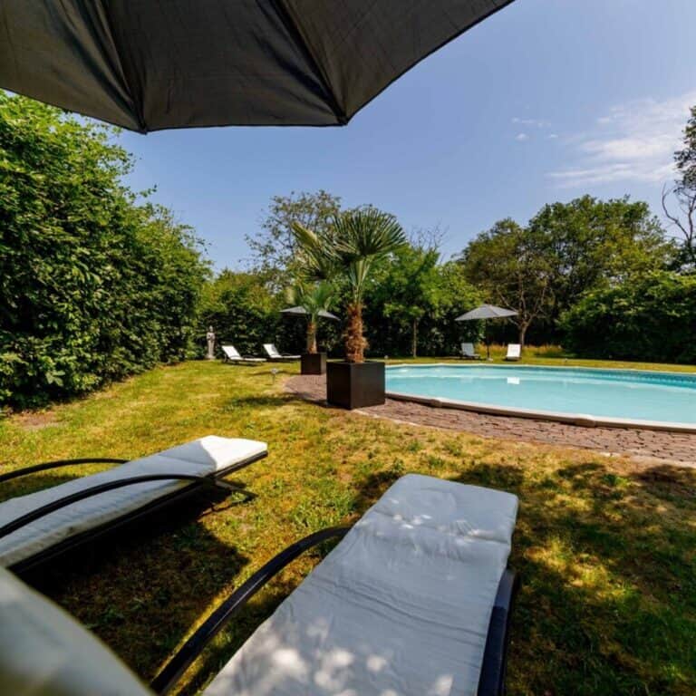 Pool view from sunlounger on sunny day