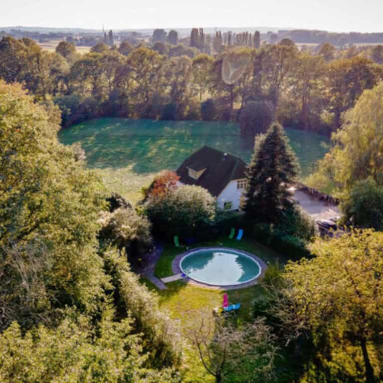 Drone picture from retreat centre with pool in nature