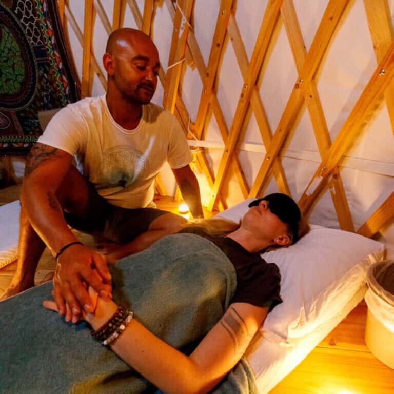 Shurandy is guiding a female participant during a psilocybin retreat