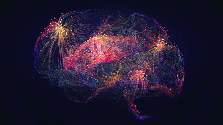 A colorful digital illustration of a human brain, showing intricate, glowing neural networks and connections in red, yellow, blue, and purple against a dark background.